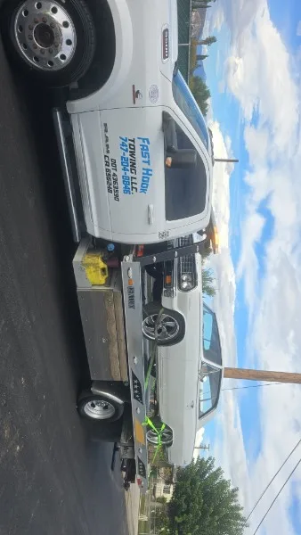 Fast Hook Towing flatbed towing a classic Chevrolet Impala