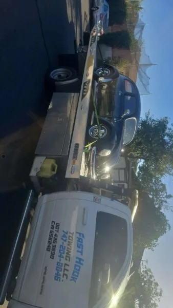 Fast Hook Towing flatbed towing a classic Volkswagen Beetle