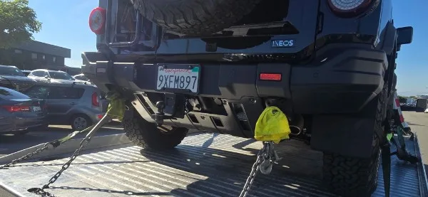 Fast Hook Towing flatbed towing an INEOS Grenadier SUV