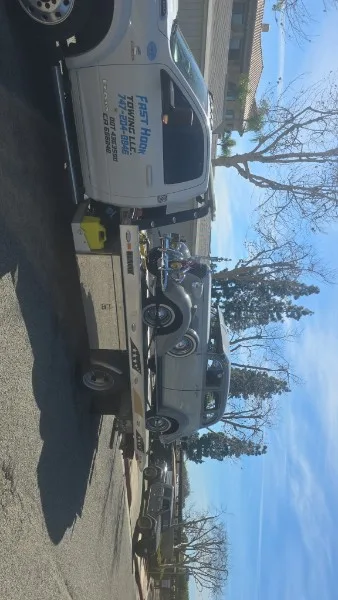 Fast Hook Towing flatbed towing a vintage BMW — classic car towing