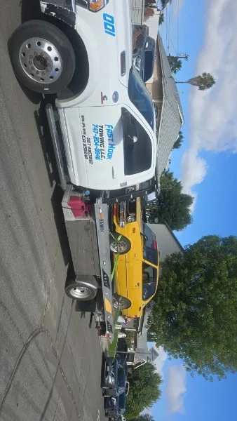 Fast Hook Towing flatbed towing a yellow sports car